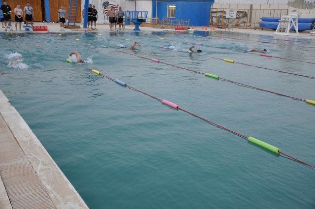 The swim took place in a restored Iraqi Air Force pool. Photo: Sgt. 1st Class Adam V. Shaw