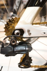 A look at the rear end, with a gold Wippermann chain, gold cassette and replaceable vertical dropouts.