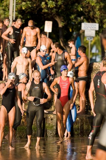 The large group of pros gets ready to head out on the swim course. Photo: Kurt Hoy The large group of pros gets ready to head out on the swim course. Photo: Kurt Hoy