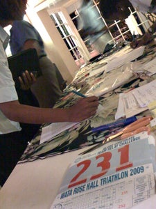 Athletes sign in at Friday night's packet pickup. Photo: Jay Prasuhn
