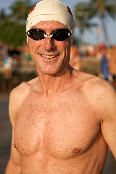 mark allen smiles before the swim at Dig Me Beach in Kona