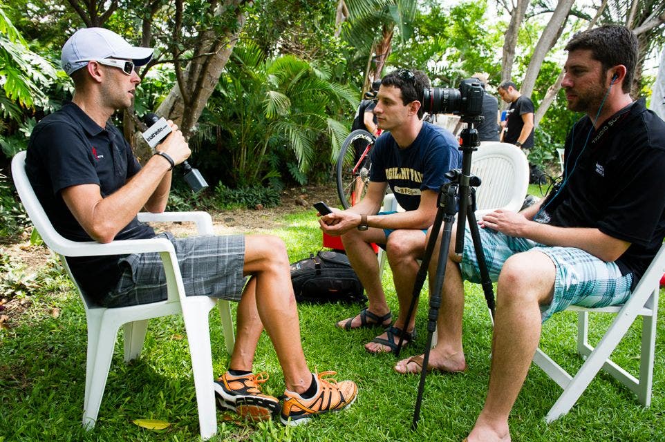 American pro Jordan Rapp conducts an interview before a 2013 Ironman triathlon.