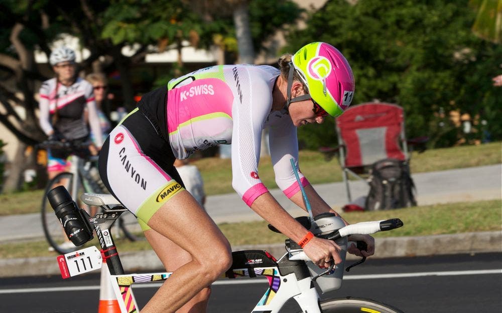 Leanda Cave races at the 2014 Ironman World Championship wearing a triathlon kit with sleeves.