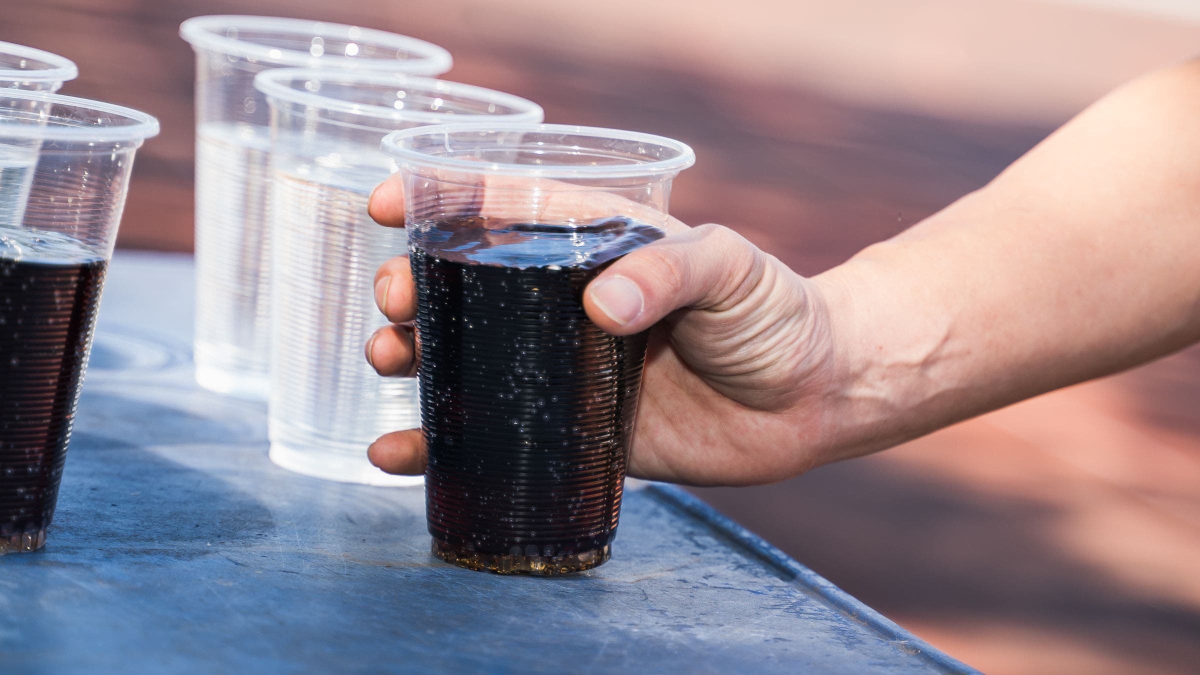 a cup of coke cola at ironman triathlon