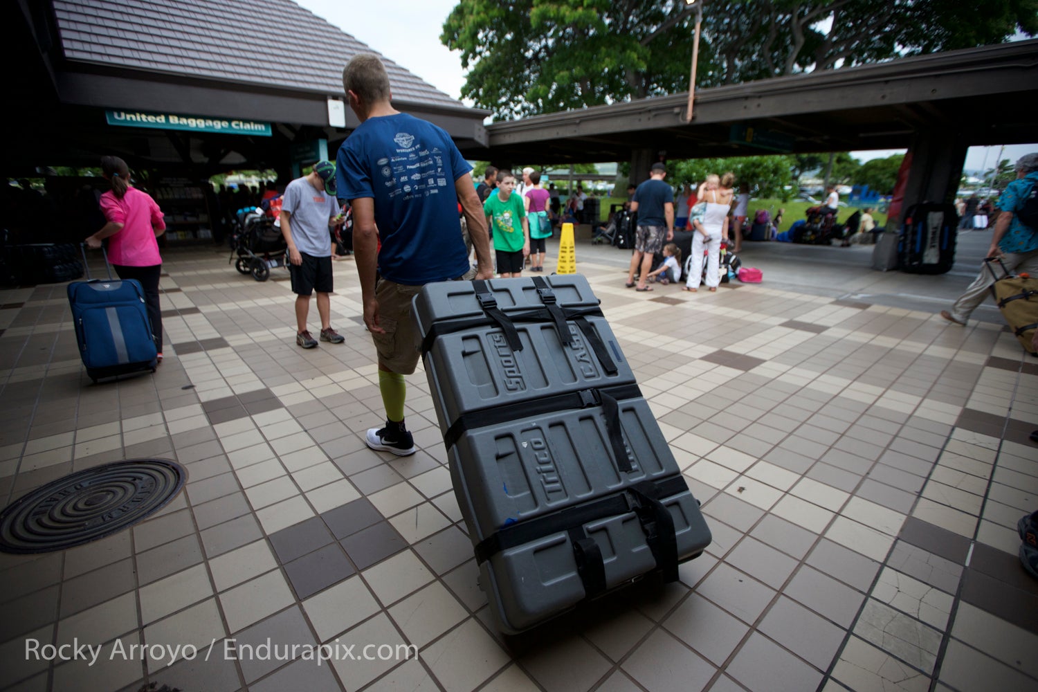 An athlete arrives at the Kona airport ahead of the 2015 Ironman World Championship.