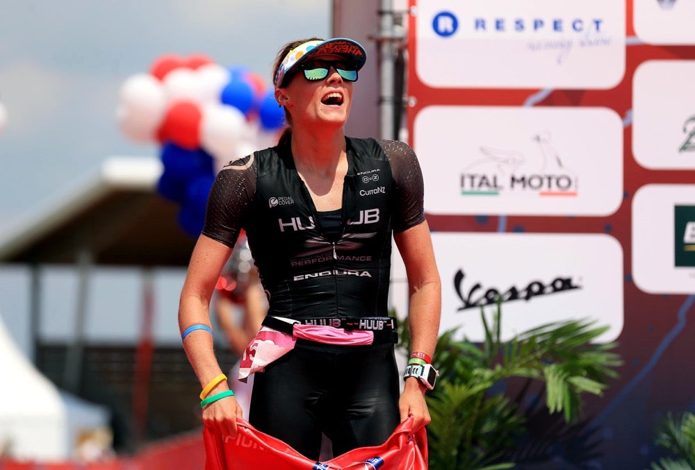 An elated Lucy Charles takes a deep breath at the finish line. Photo: Stephen Pond/Getty Images for Challenge Triathlon
