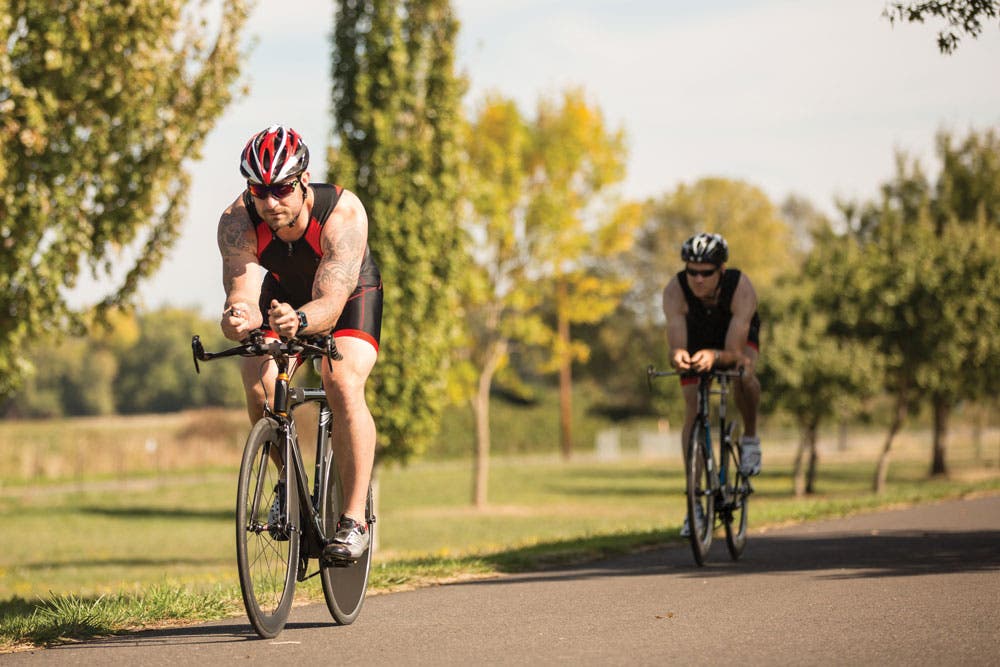Triathletes on bikes are learning how to race by feel.