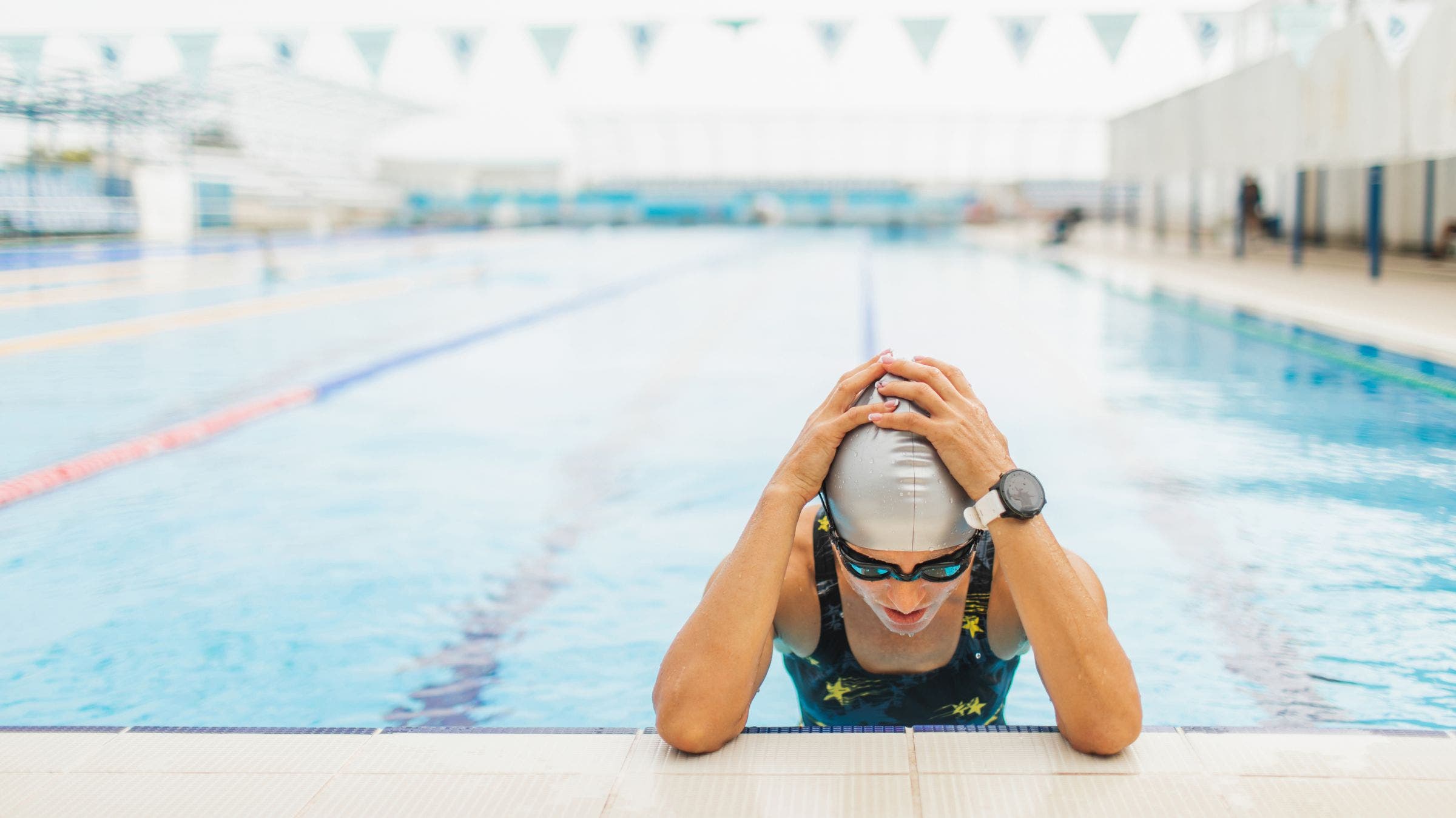 A swimmer is frustrated in the pool.