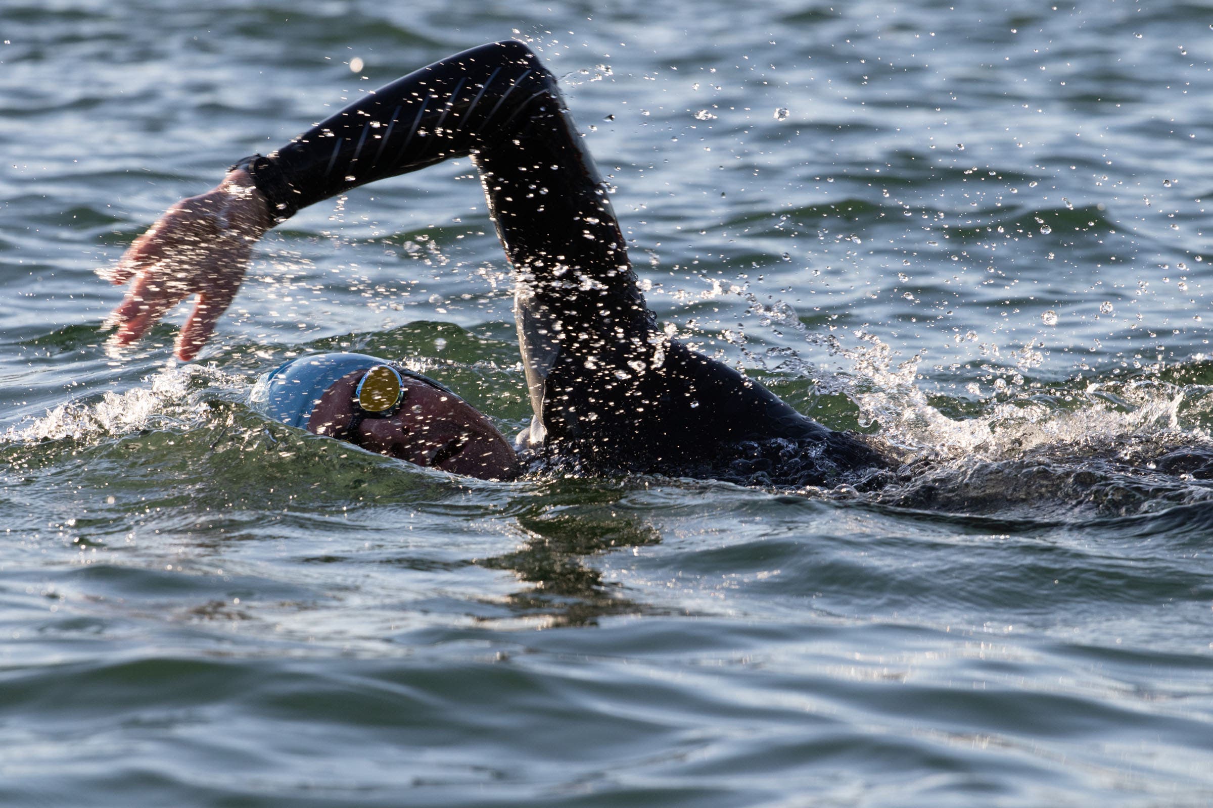 A swimmer demonstrates bilateral breathe for triathlon