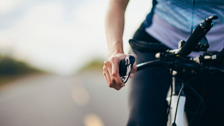 A triathlete experiences Numb fingers when riding a bike, foot tingles when running, headaches after swimming