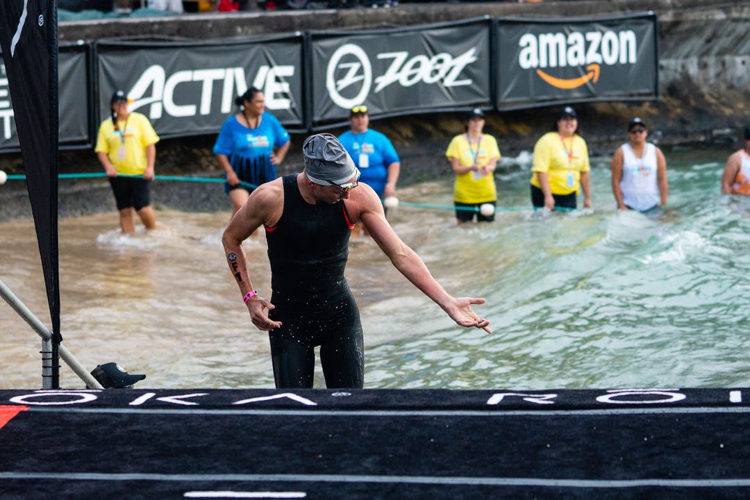 Daniela Ryf evaluates the effects of a jellyfish sting she suffered before the start of the swim at the 2018 World Ironman Championship.