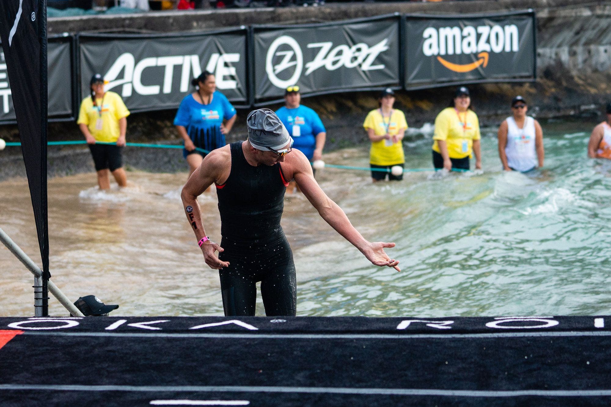 Daniela Ryf evaluates the effects of a jellyfish sting she suffered before the start of the swim at the 2018 World Ironman Championship.