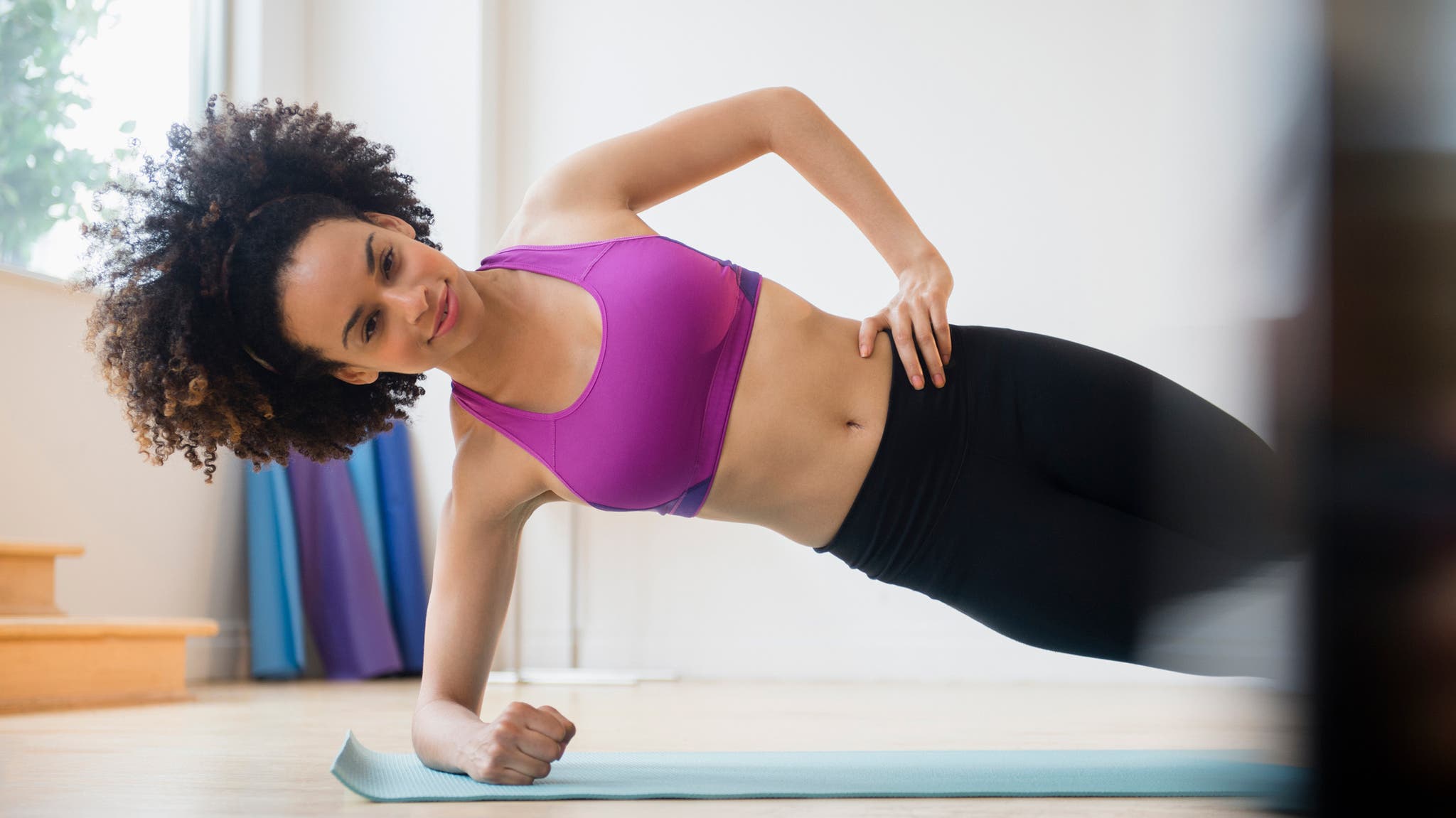 A women demonstrates Side Plank.