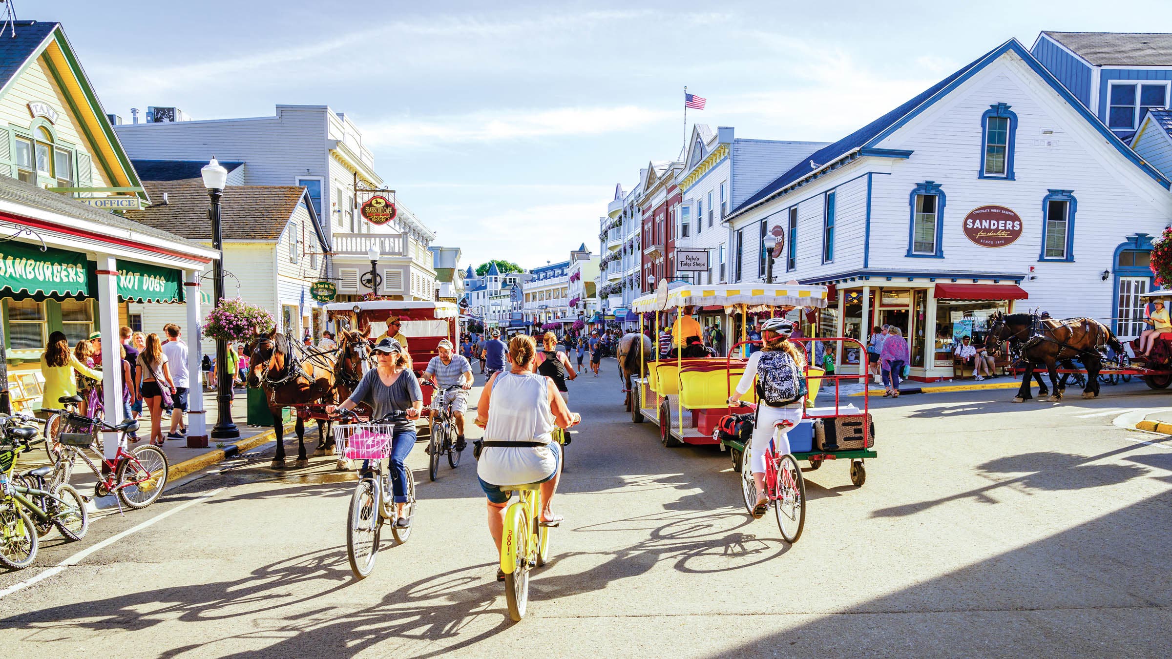 Tourists biking in Mackinac, one of the best triathlon vacation destinations for couples.