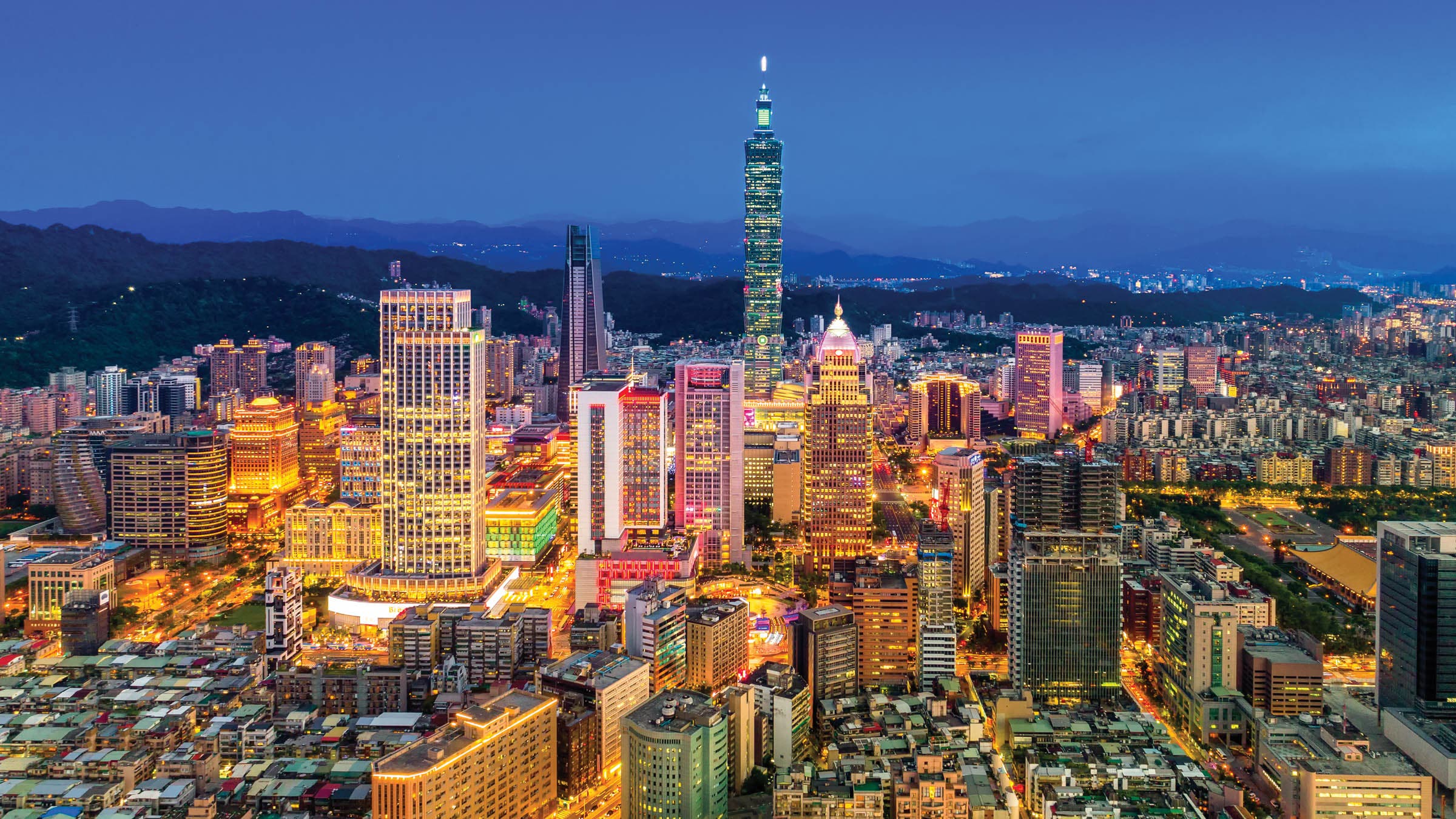 Capital city of Taiwan with view of prominent Taipei 101 Tower and busy street in Xinyi Financial District