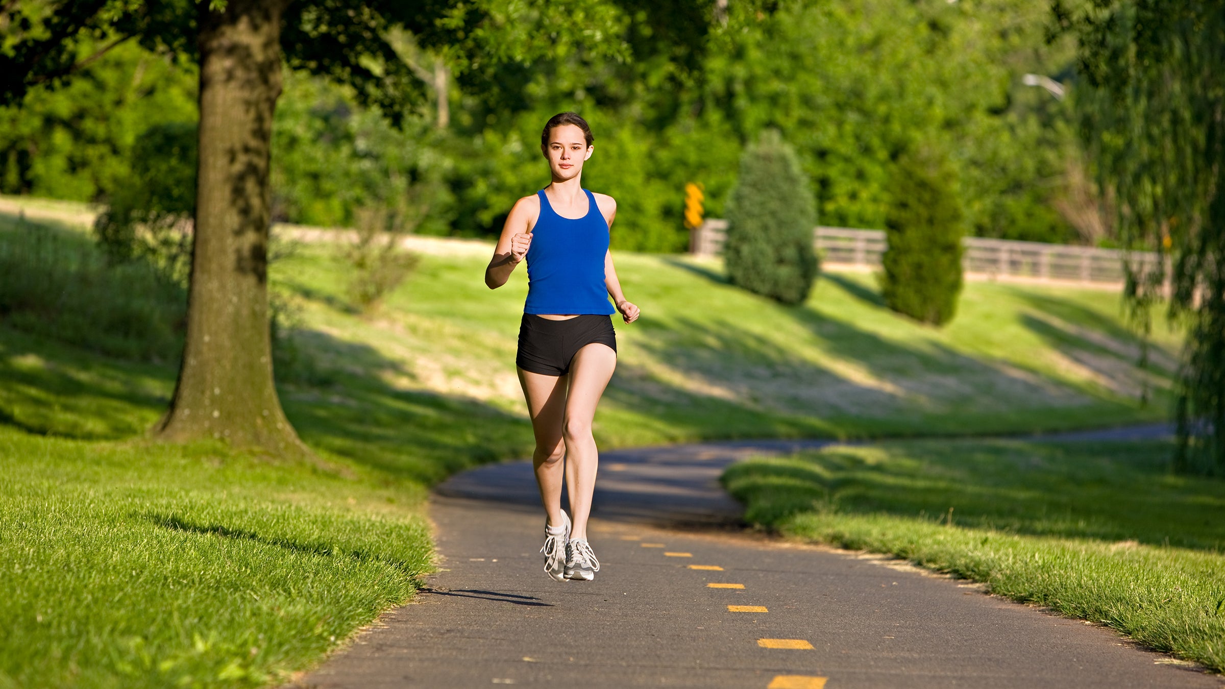 woman runner time trial on path