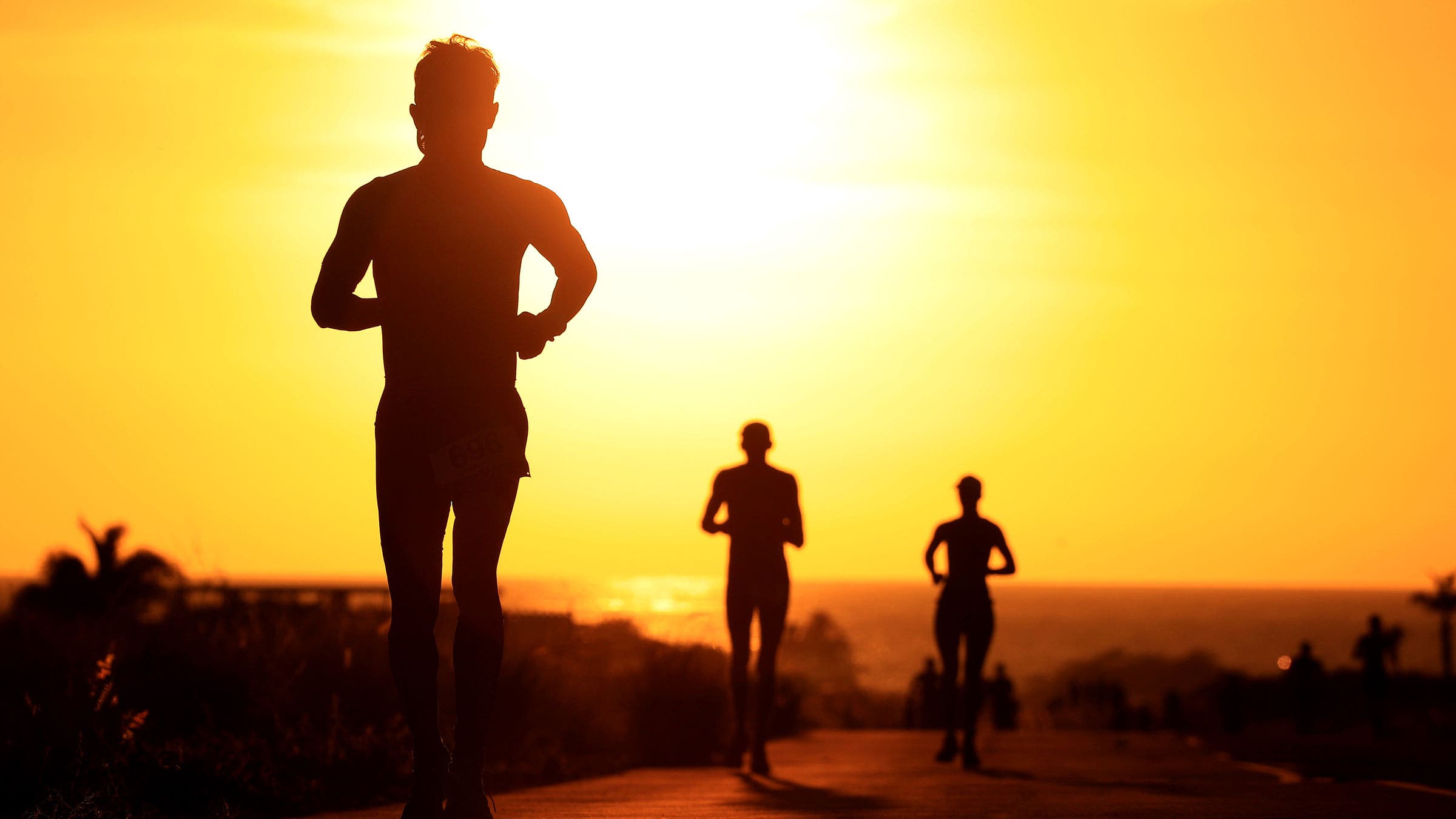 An athlete runs on the ironman world championship kona run course