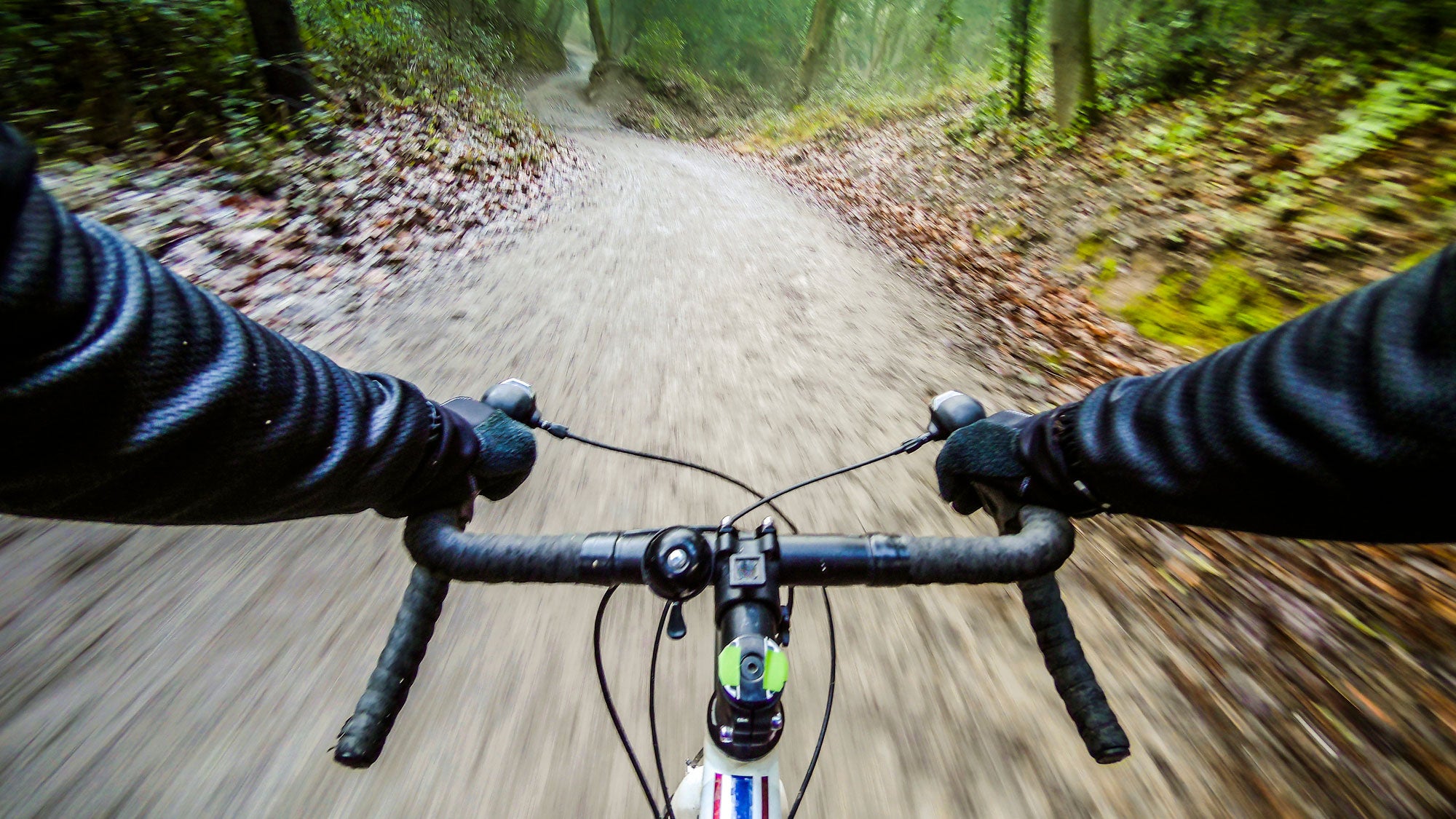An athlete out gravel cycling