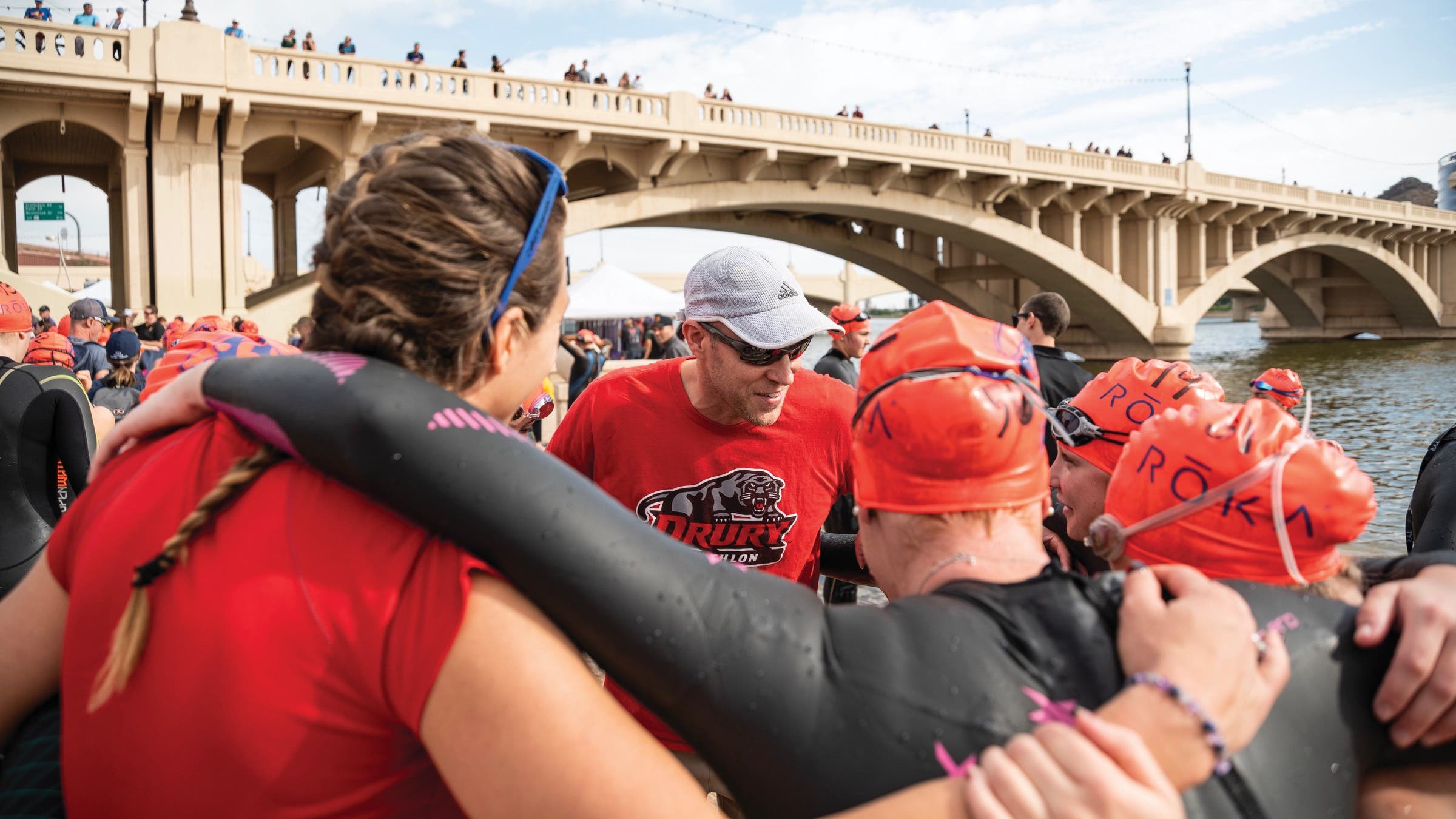 An NCAA triathlon team cheers before the college triathlon championships.