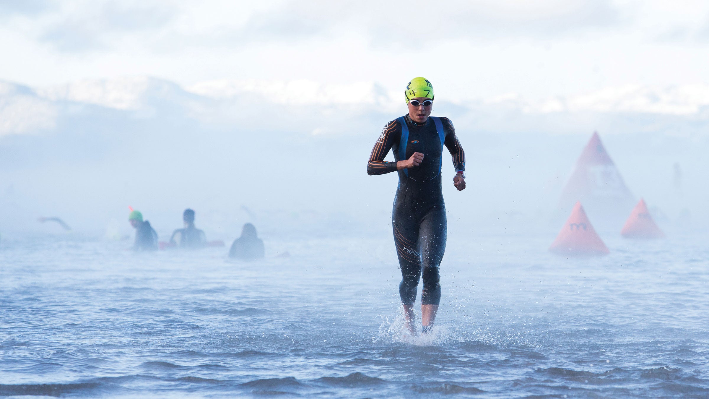 Canada's Angela Naeth exits the water after a frigid swim at the 2013 Ironman Lake Tahoe triathlon.