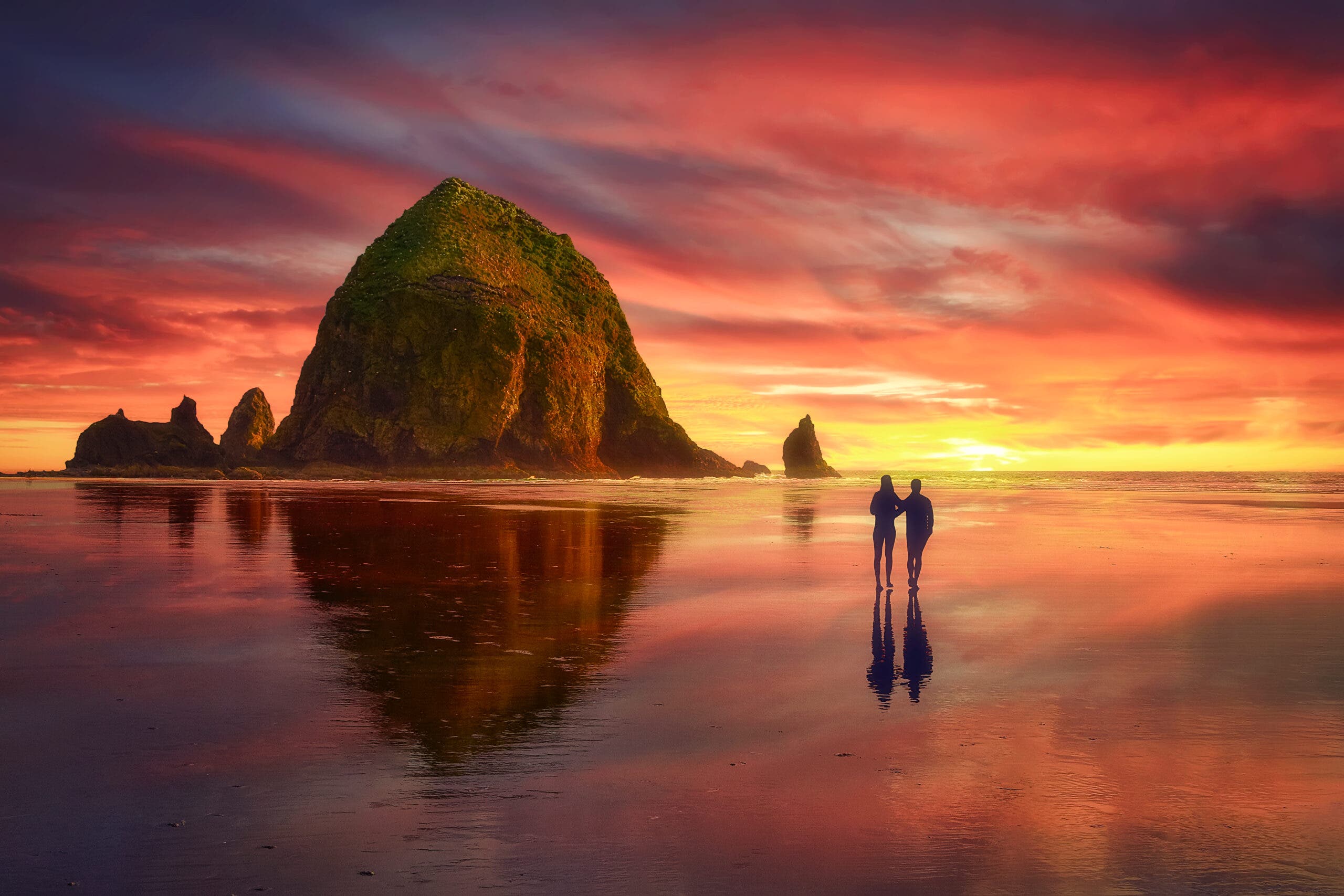 Sunset at cannon beach oregon, one of the best triathlon vacation destinations for couples.