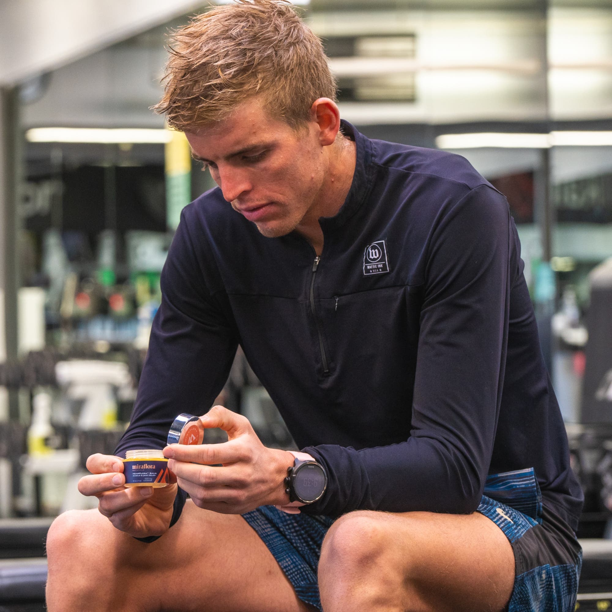 Sam Long in the gym with Miraflora CBD balm