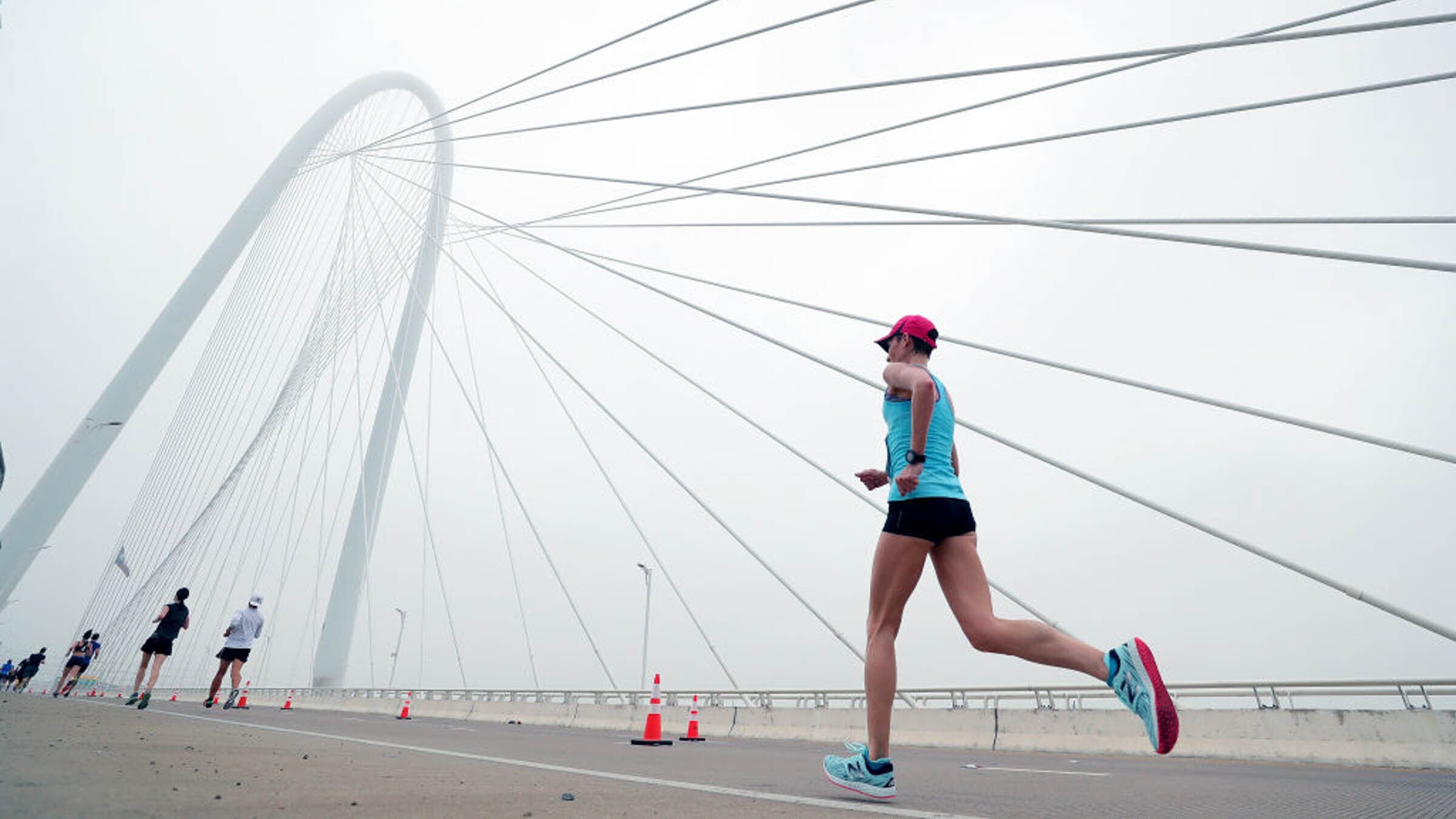 DALLAS, TX - MARCH 25:  Participants run across the Margaret Hunt Hill Bridge during the Toyota Rock 'N' Roll Dallas Half Marathon on March 25, 2018 in Dallas, Texas.  (Photo by Tom Pennington/Getty Images for Rock 'N' Roll Marathon)