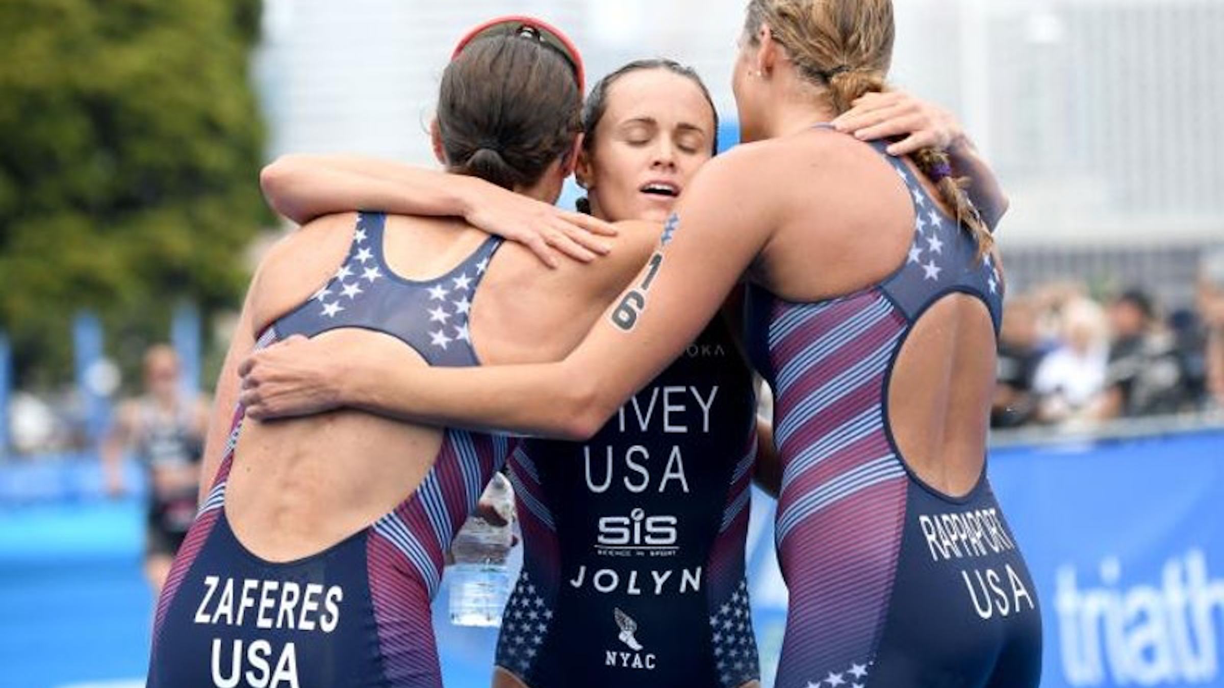 Spivey, Zaferes, and Rappaport hug after a podium sweep in Yokohama in 2019.