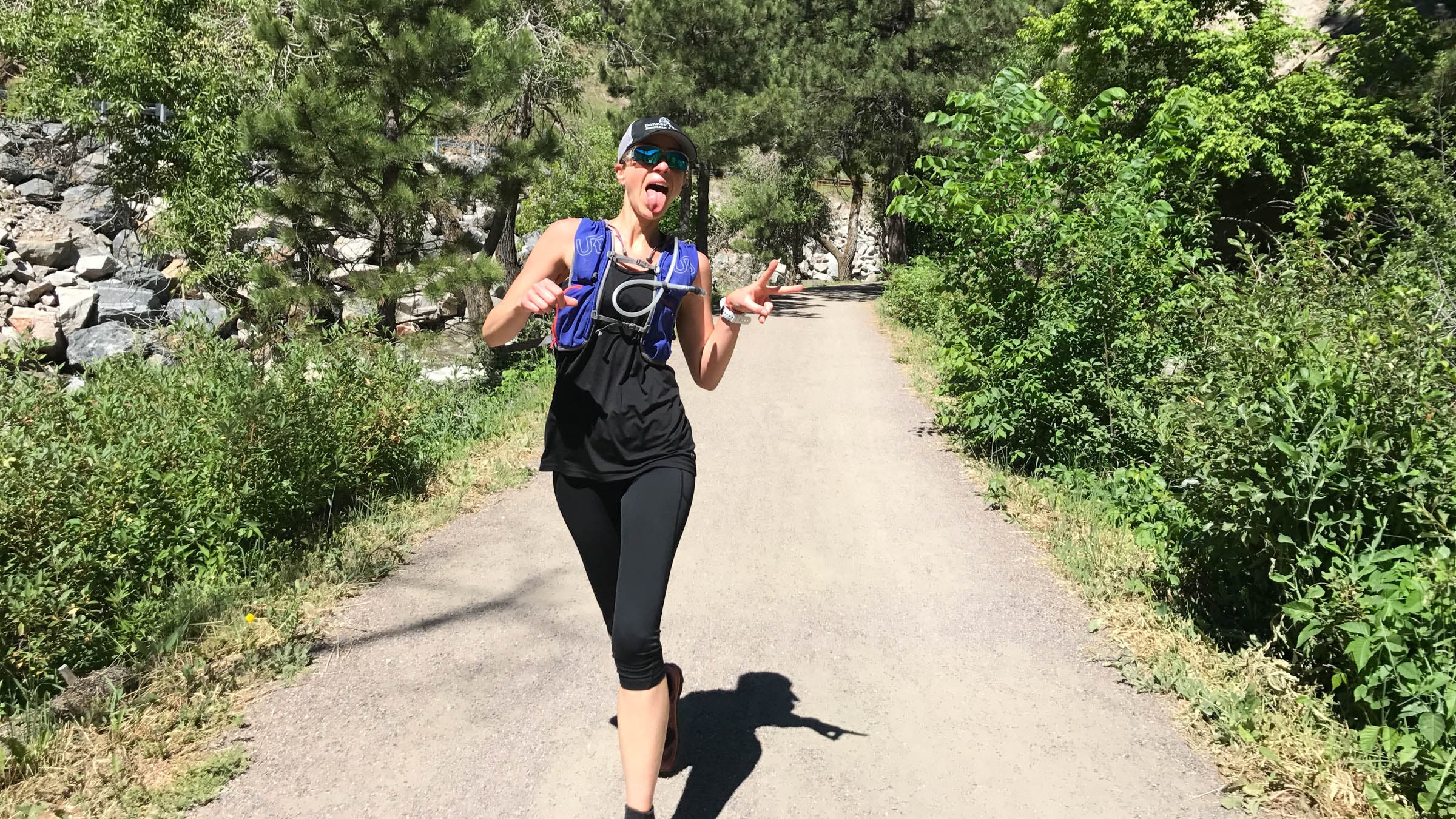 Woman smiling while trail running