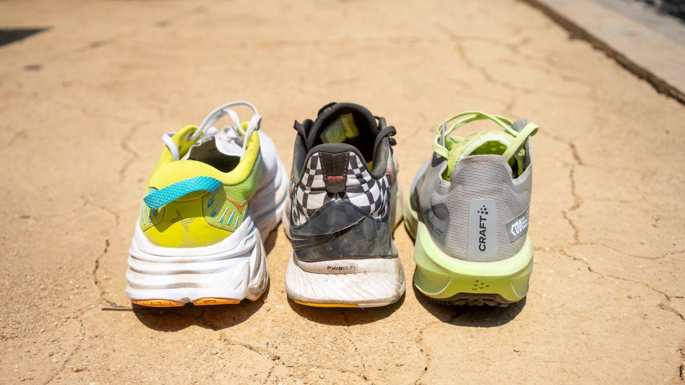 A rear view of three running shoes.