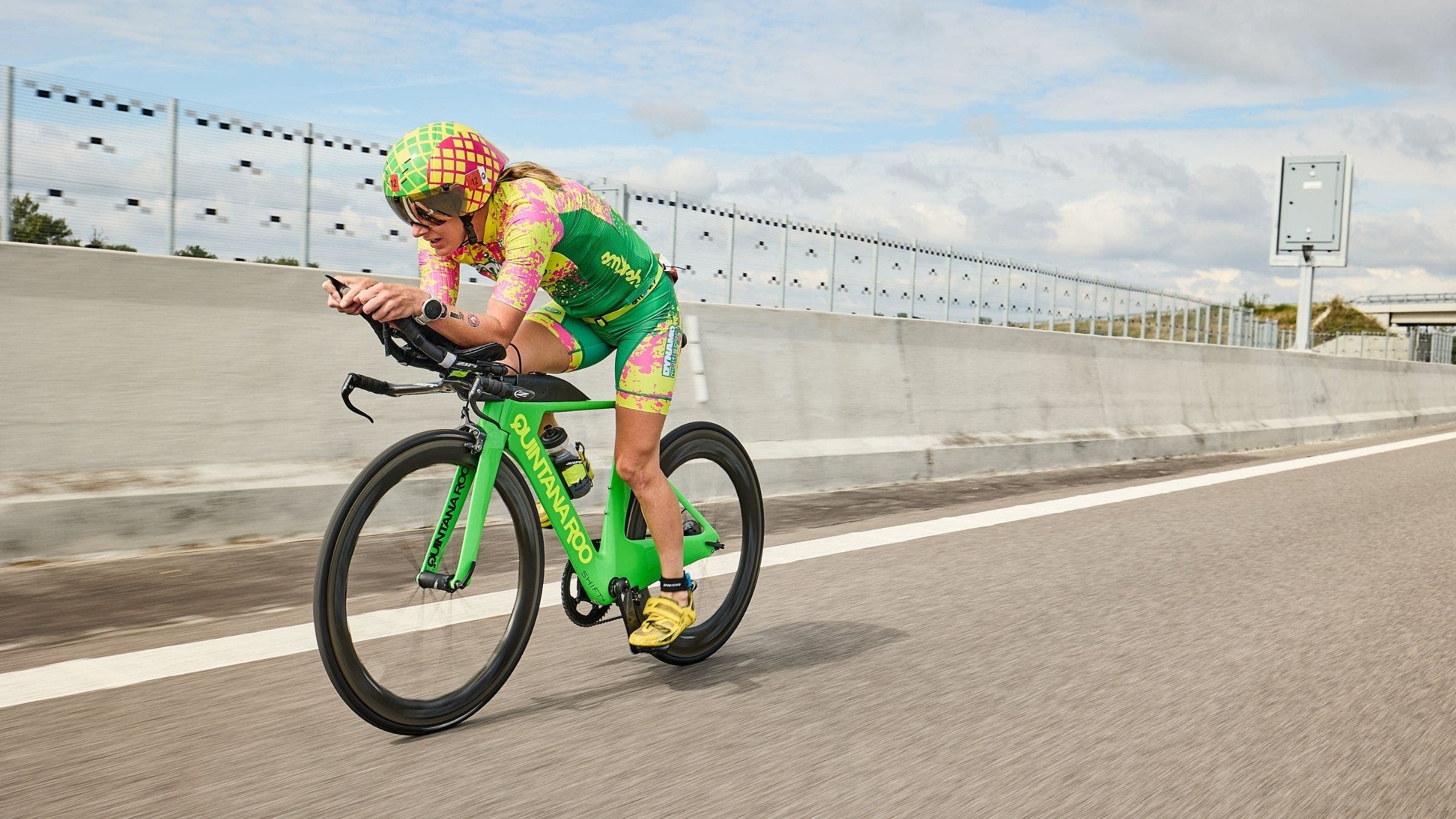 Haley Chura, a triathlete, rides in aero position at The Championship triathlon in Samorin.