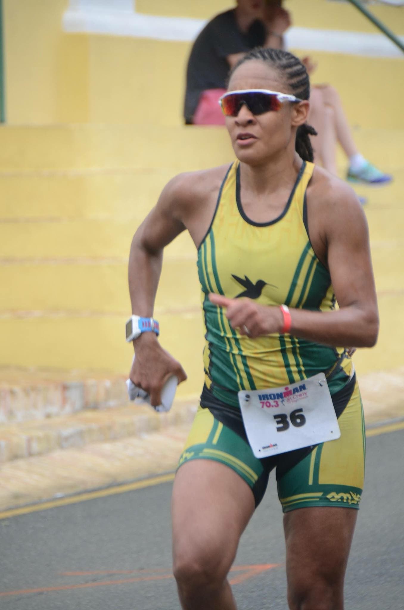 Tiencia James, a triathlete runs with determination during a race.