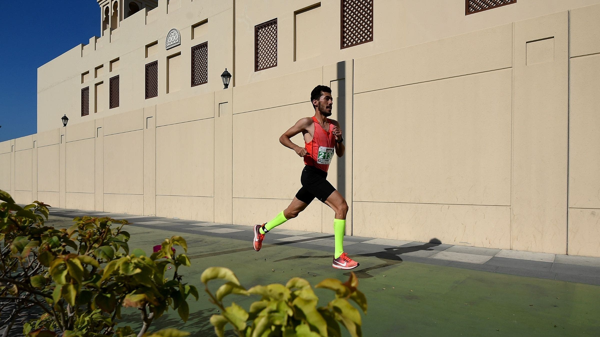 An athlete competes in the run section during the Ironman 70.3 Dubai 2018 on February 2, 2018 in Dubai, United Arab Emirates