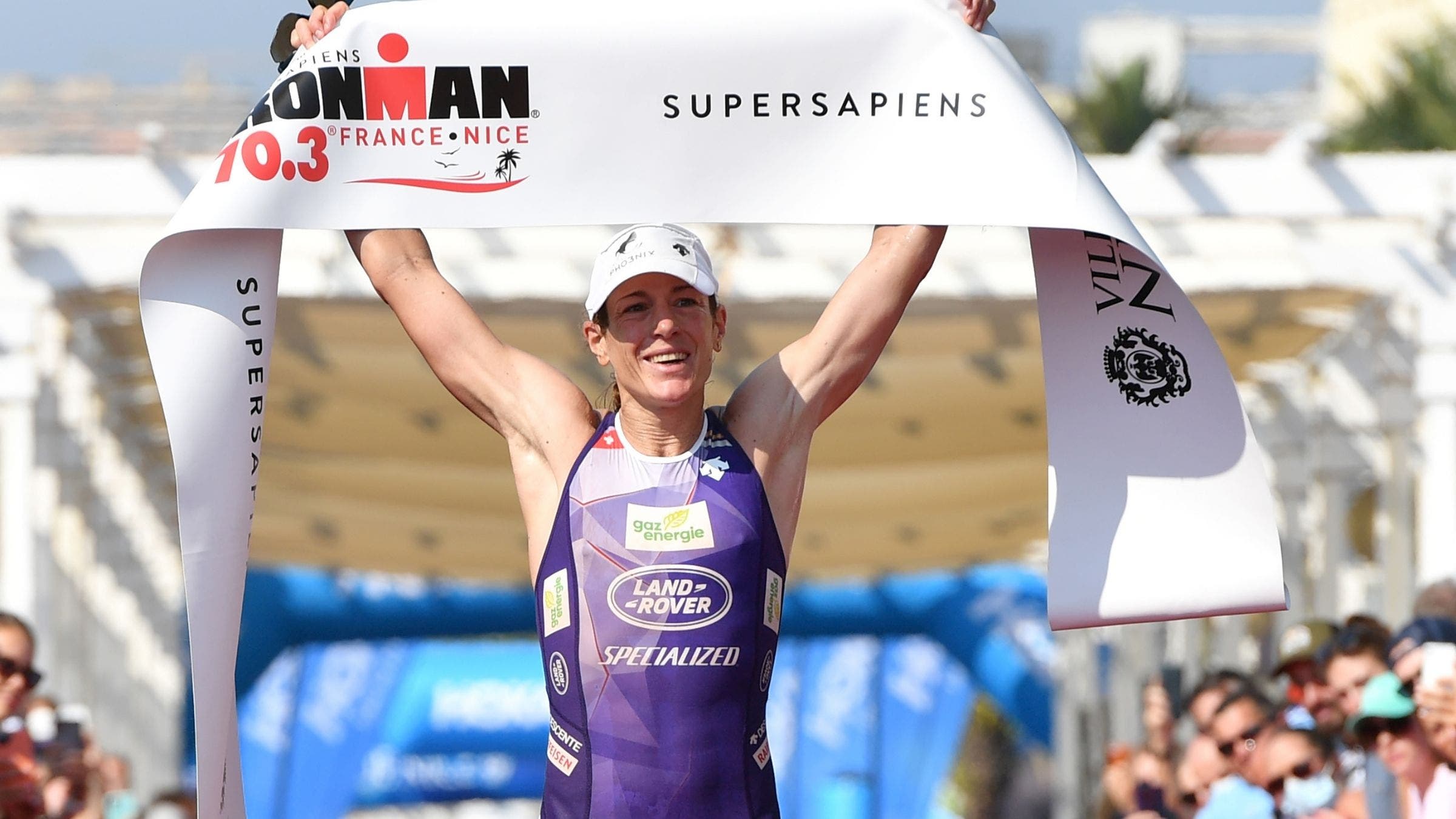 Nicola Spirig celebrates as she crosses the finish line at Ironman 70.3 Nice.