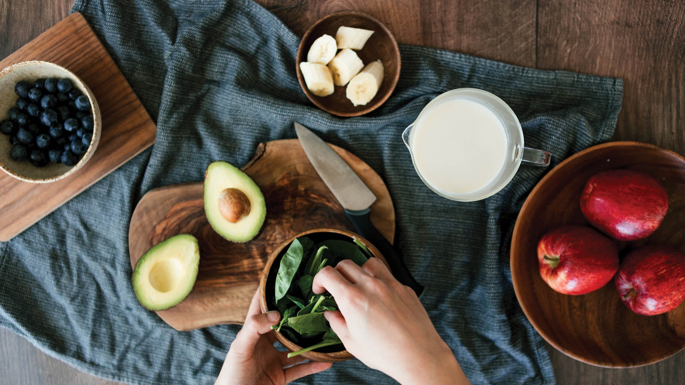 Hands preparing vegetarian meal