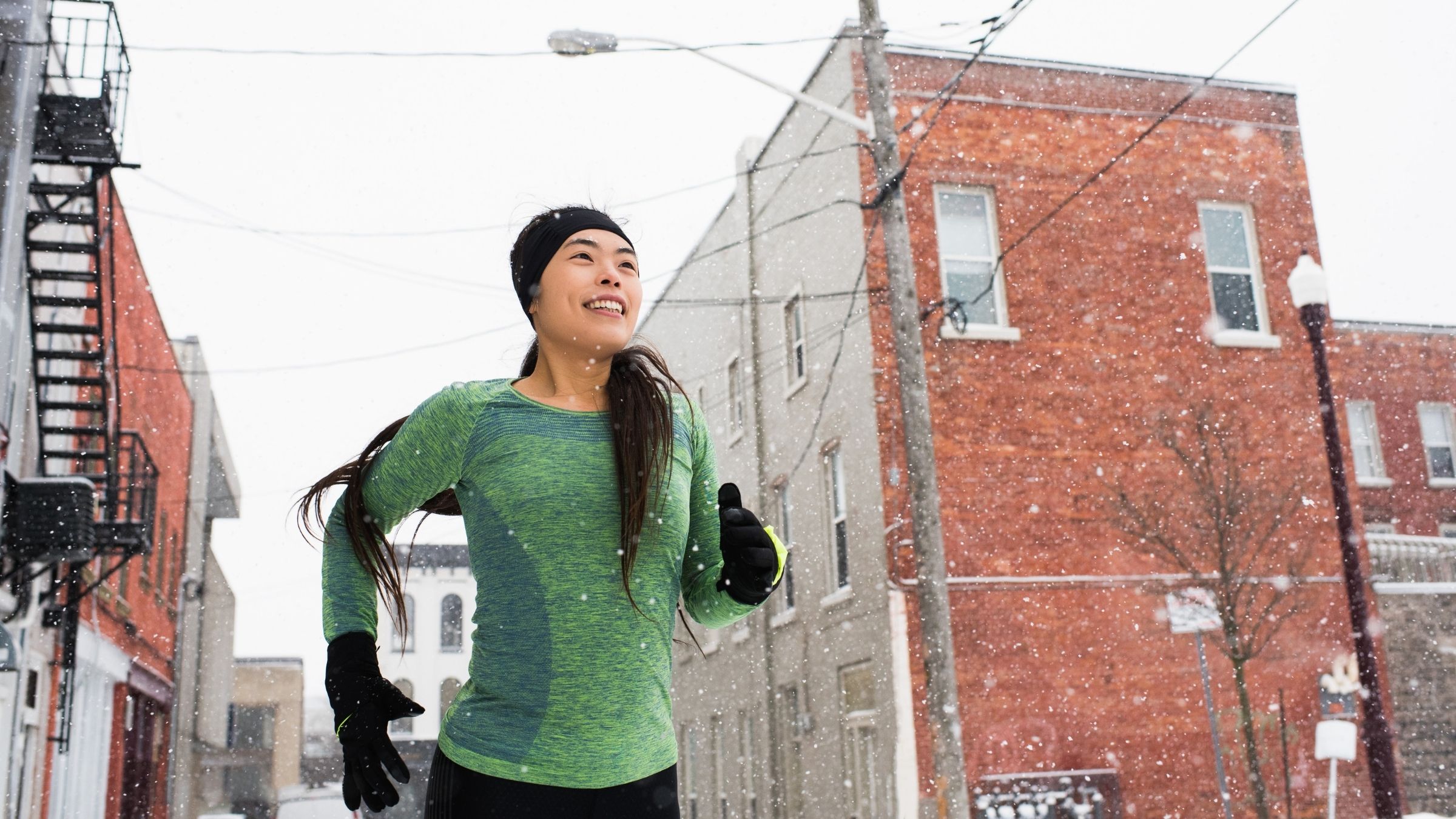 A female athlete runs during triathlon off-season training.
