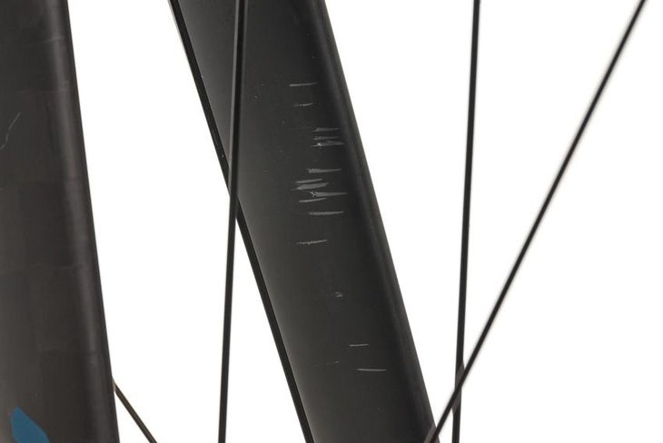 A close-up photo of a scuff on a bike frame from The Pros Closet when buy a used bike online.
