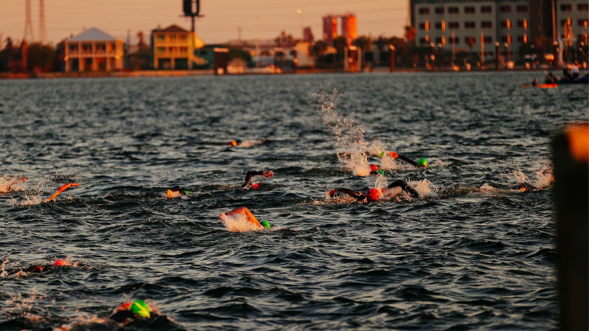 Triathletes make their way through the Ironman 70.3 Texas swim course