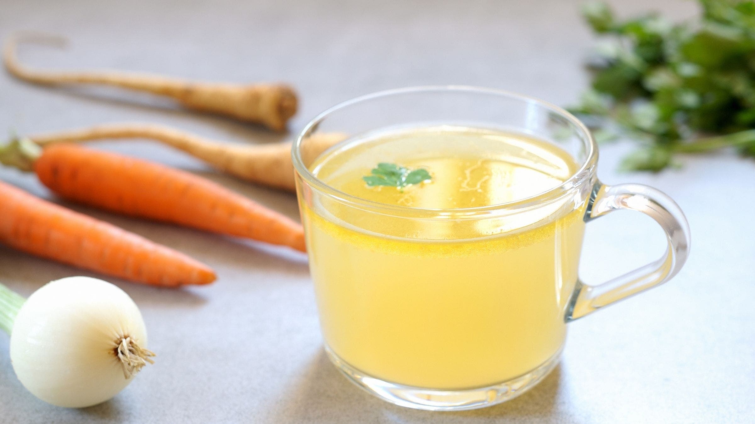 A glass of bone broth as an alternative to post-workout drinks that aren't smoothies