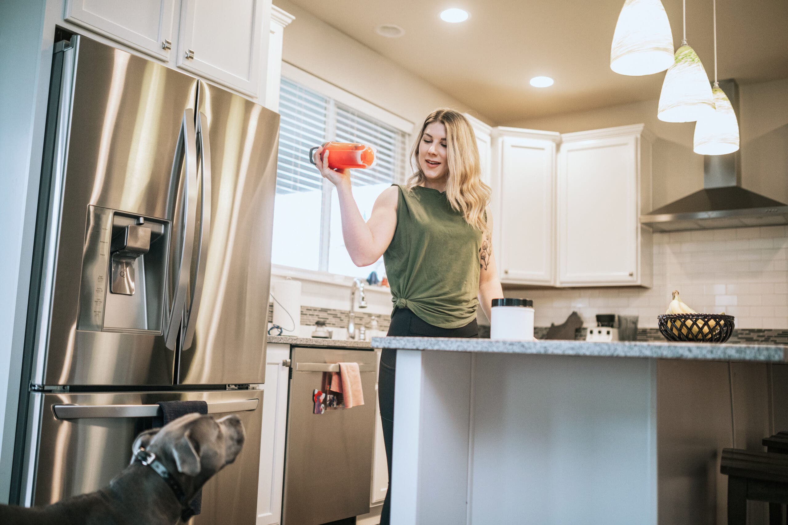 An adult woman mixes her own sports drink with natural ingredients.