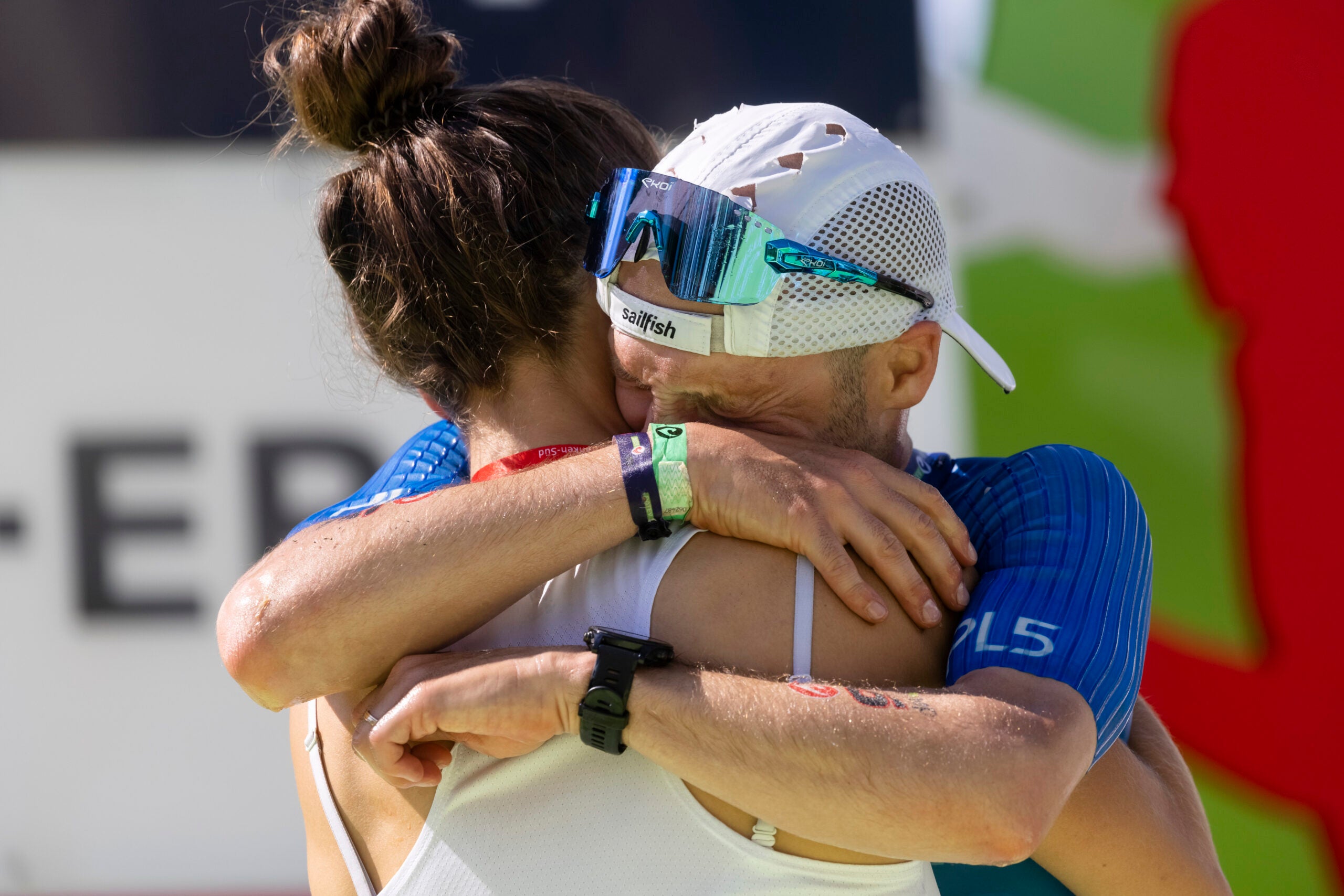 Pro triathlete Patrick Lange of Germany embraces his wife Julia after winning the Challenge Roth 2021.