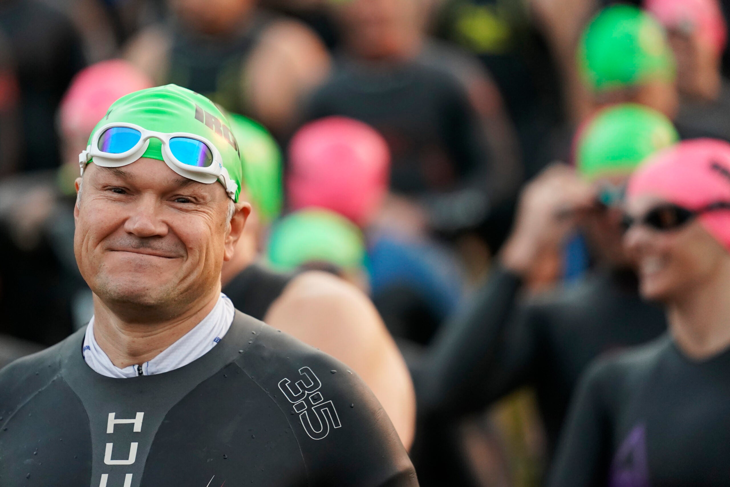 An athlete smiles before racing a half ironman