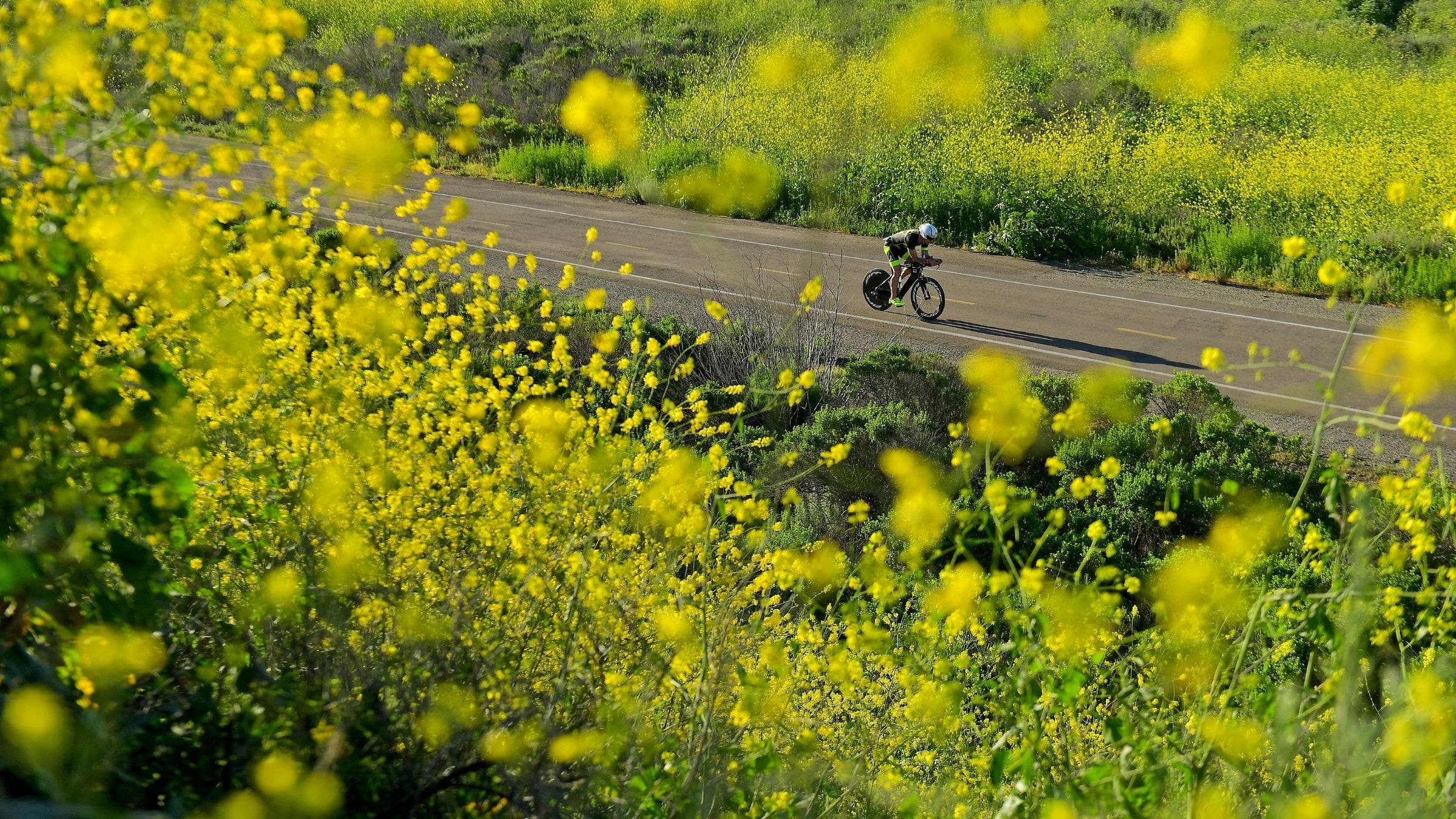 An athlete rides the bike course at Ironman 70.3 Oceanside