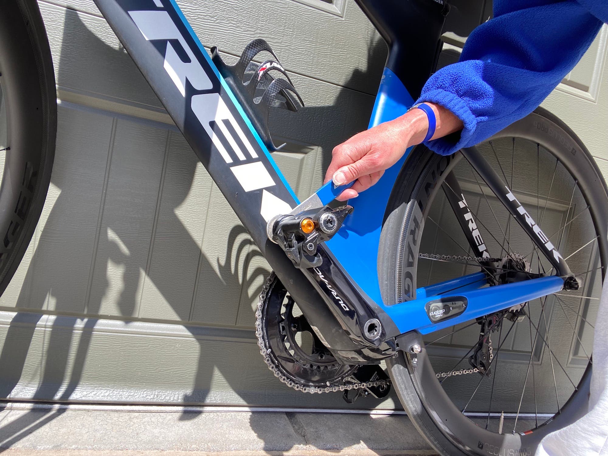 Taking the pedals off your bike is easiest in an upright position.