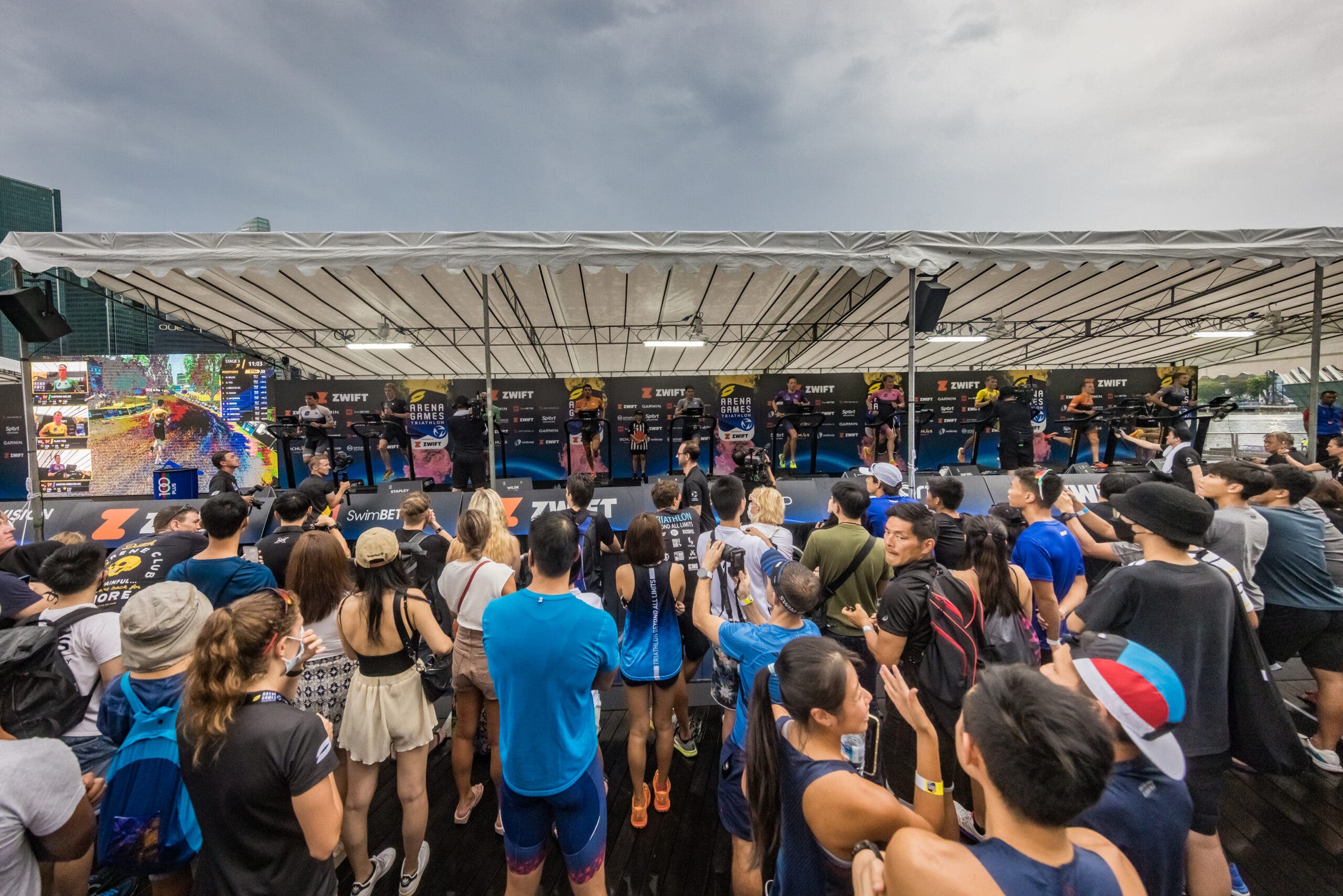 Spectators watch the super league arena games in singapore