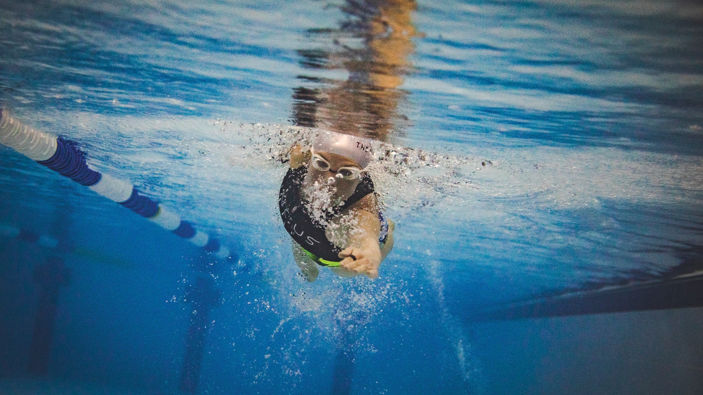 Ruth Astle swimming in a pool