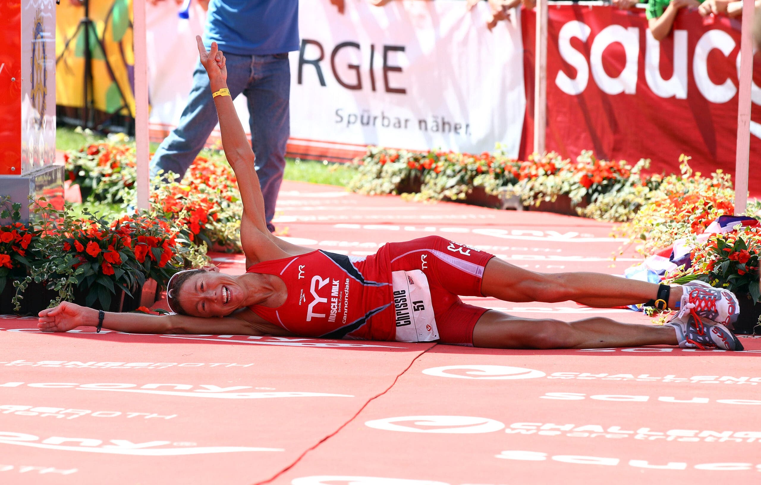 Chrissie Wellington rolls across the finish line at Challenge Roth, after setting a new world record in 2011.