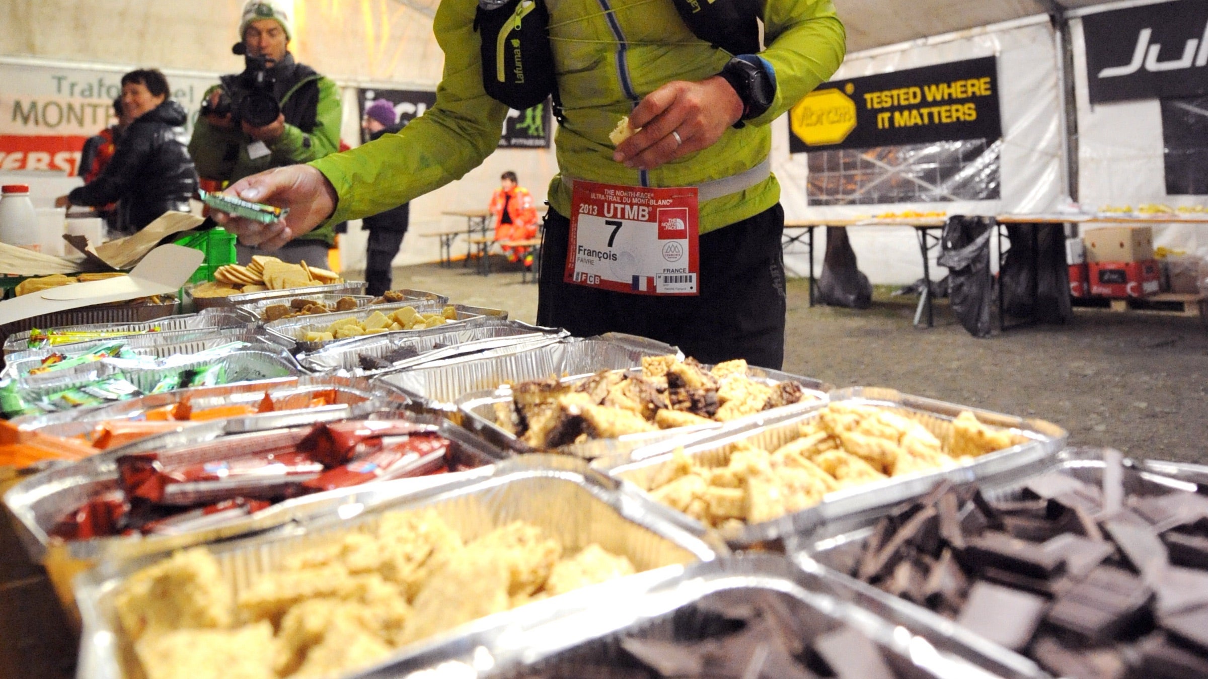 An ultrarunner at UTMB visits an aid station.