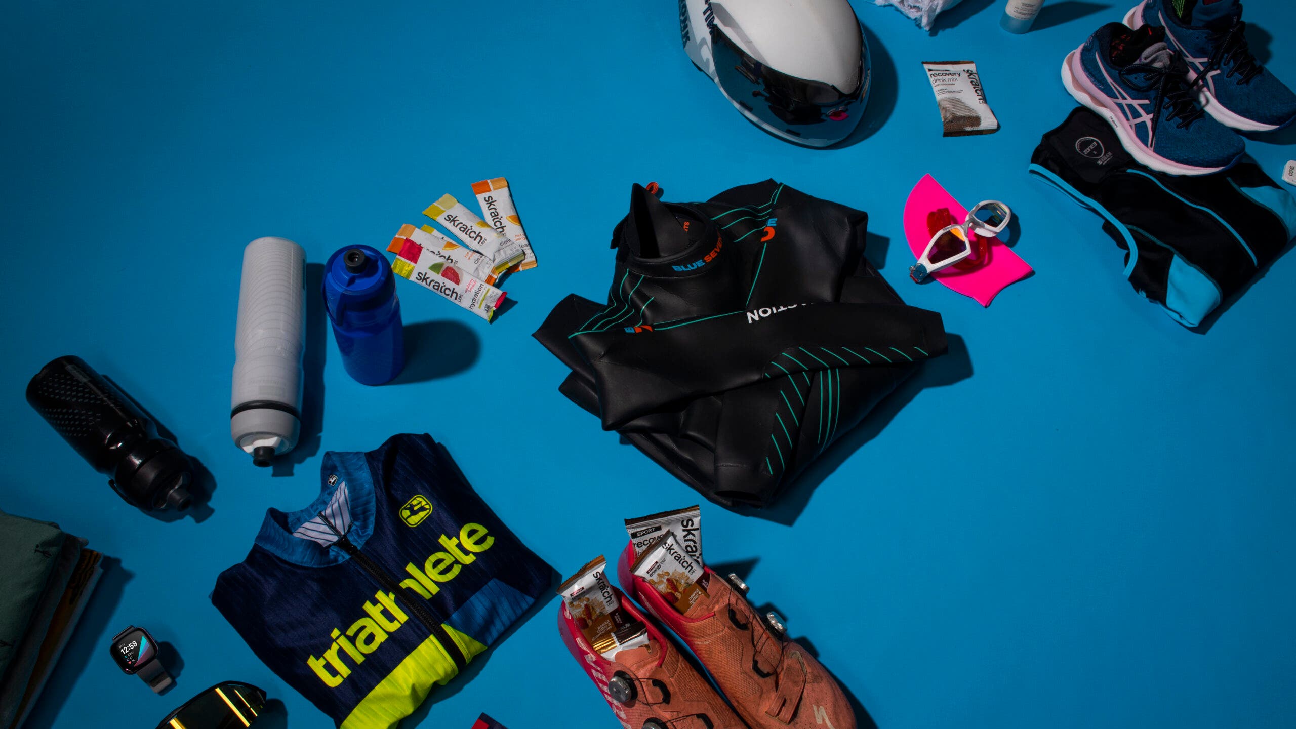 Gear is laid out while packing for a triathlon