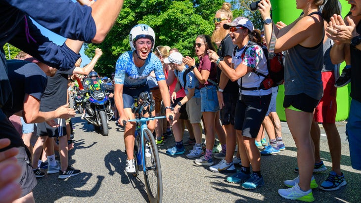 Fenella Langridge triathlete rides her bike through an Ironman